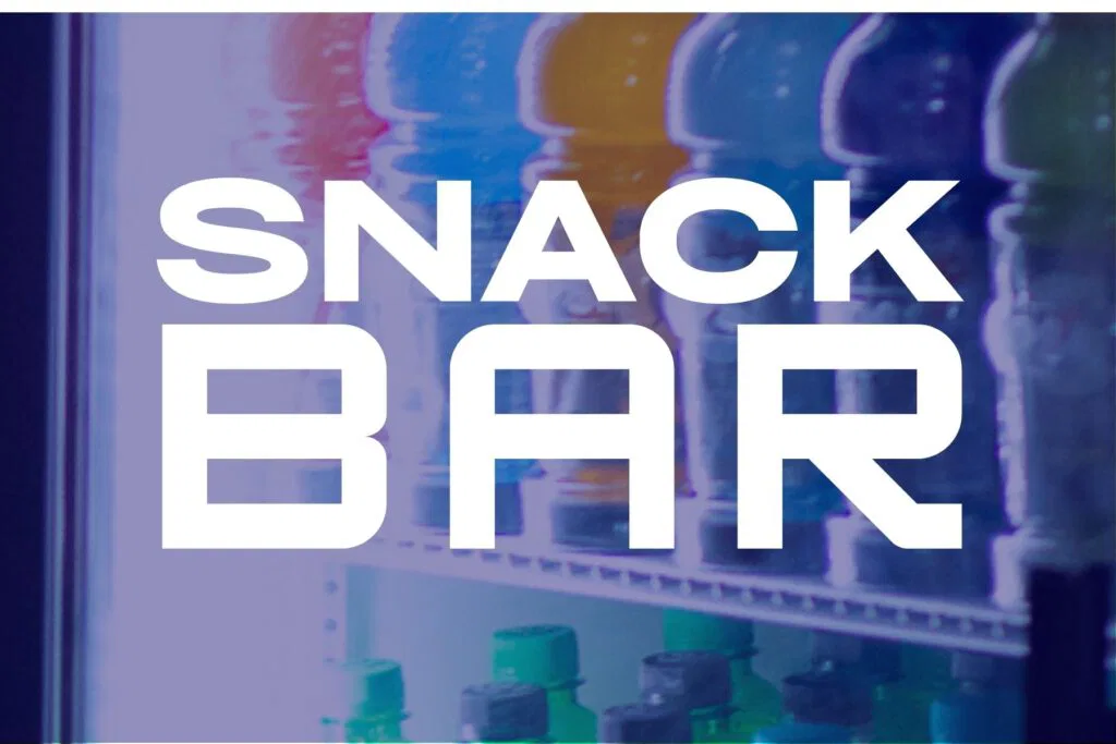 A vending machine filled with various snacks, located at The Rush Funplex.